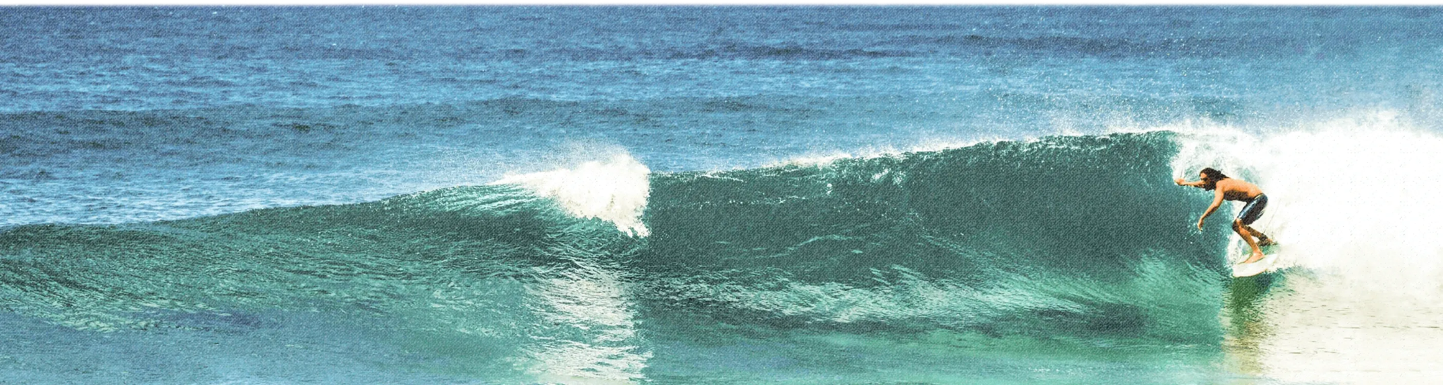 Jason surfing inside a breaking wave